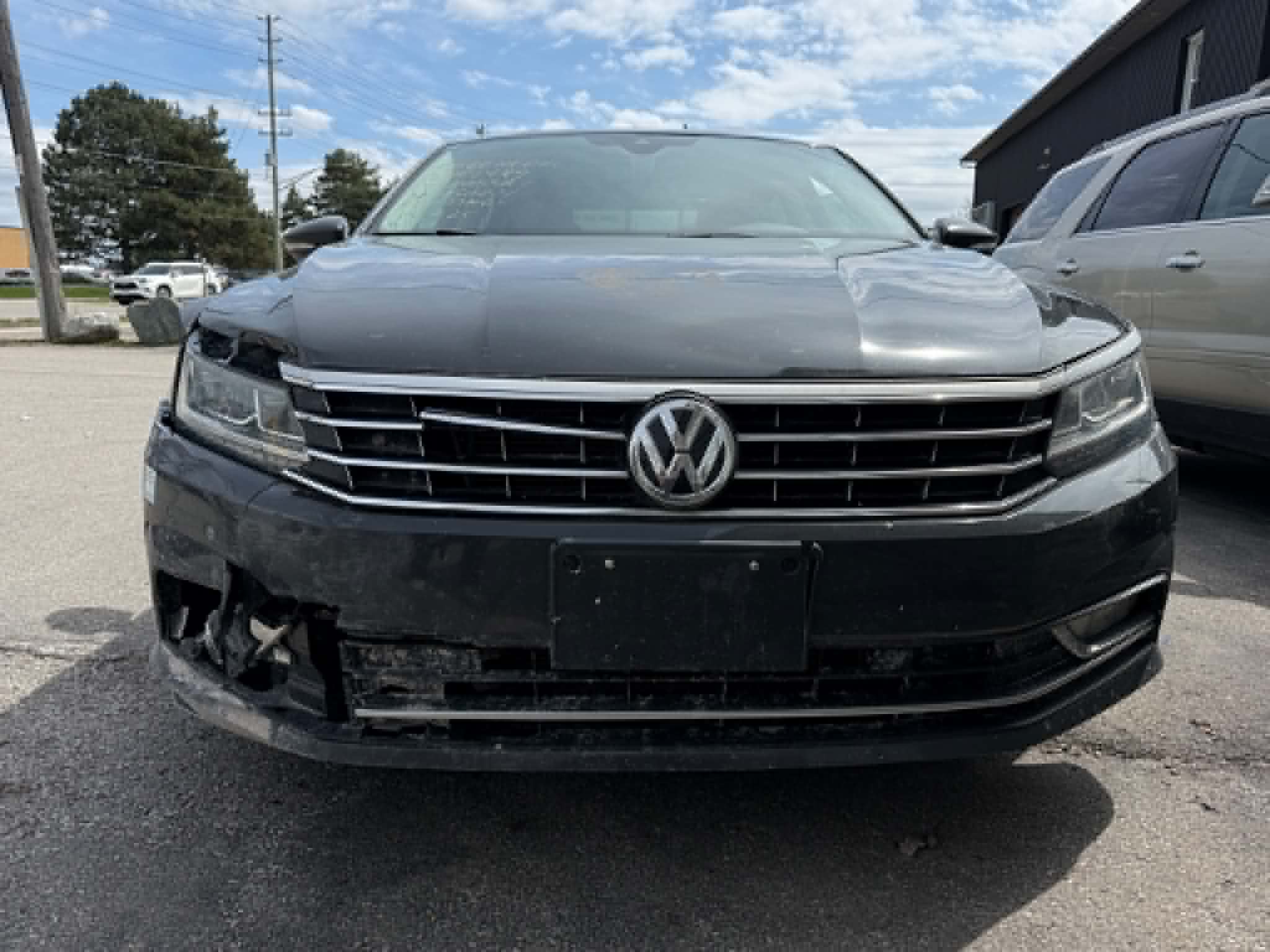 Before and after collision repair on a silver sedan — before