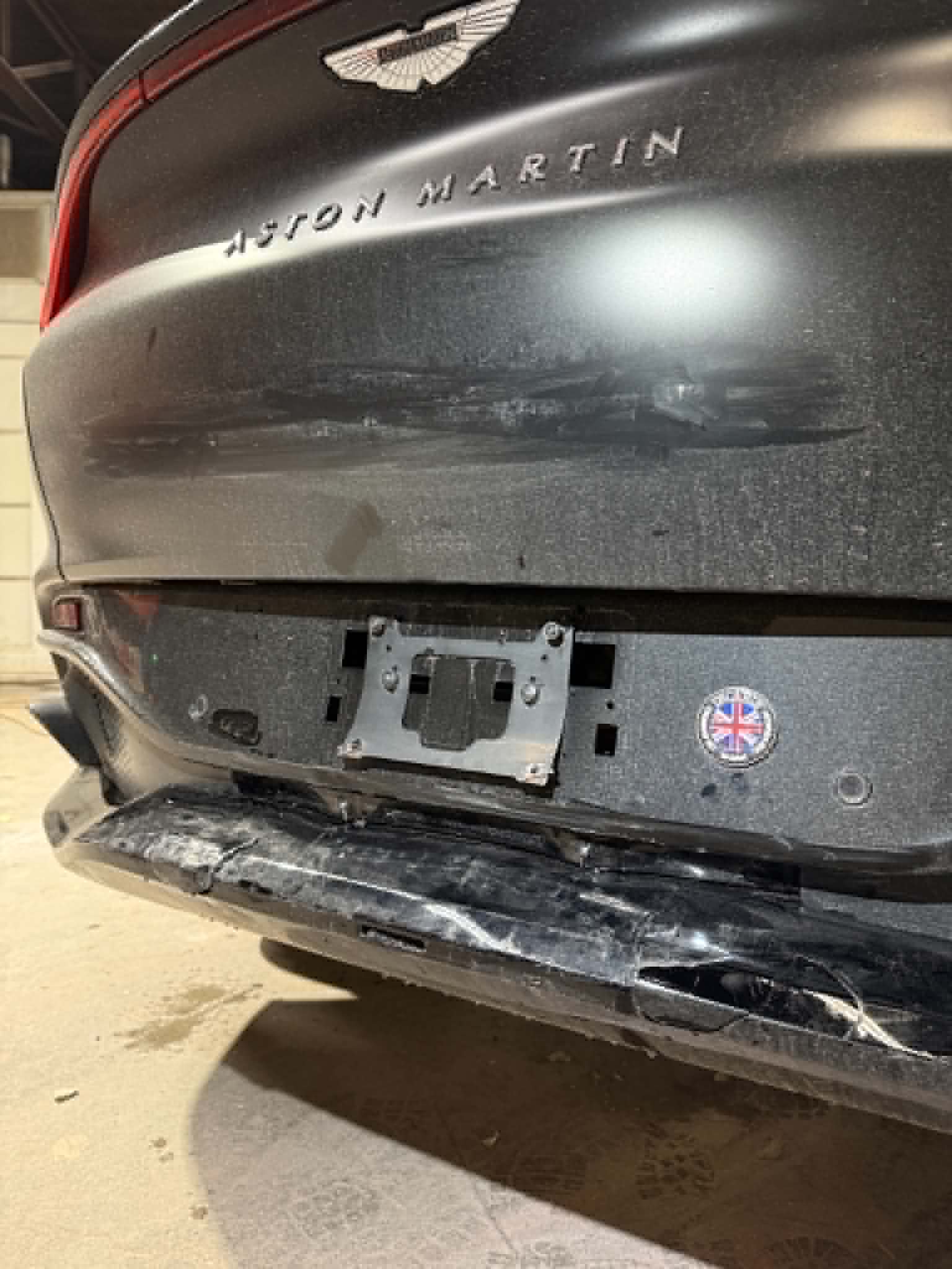 Before and after front-end repair on a dark SUV — before