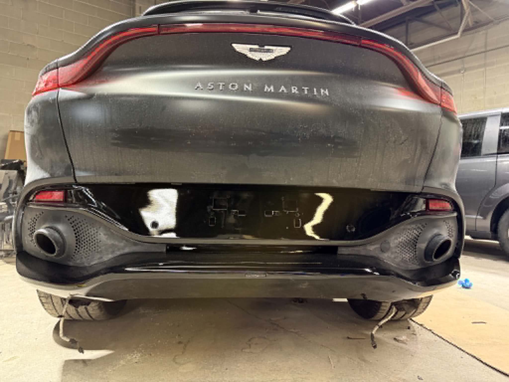 Before and after front-end repair on a dark SUV — after